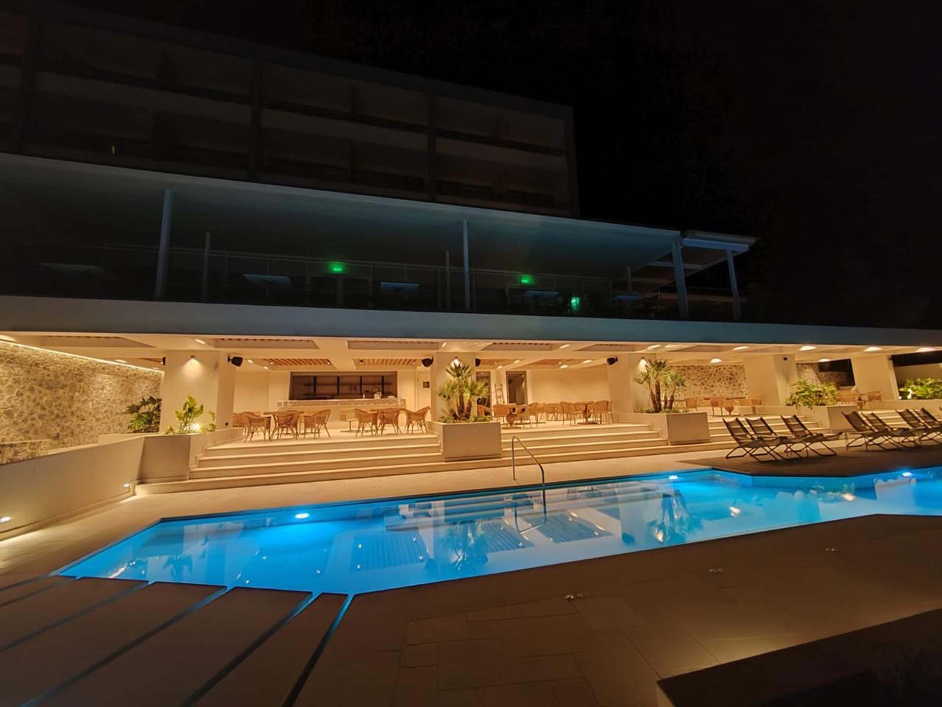 Water and Flame hotel divani pool renovation side view